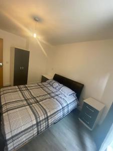 Ένα ή περισσότερα κρεβάτια σε δωμάτιο στο Arcadian Apartment