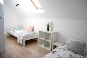 Ένα ή περισσότερα κρεβάτια σε δωμάτιο στο Emma Apartamenty