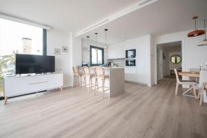 Televisyen dan/atau pusat hiburan di Apartament Olivia Torredembarra