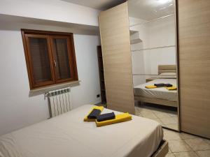 Postel nebo postele na pokoji v ubytování Appartamento Magnolia 2