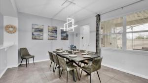 a dining room with a table and chairs at 1840 Caribbean View in Kissimmee