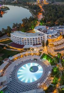 an overhead view of a building with a large swimming pool at Kaya Side in Side