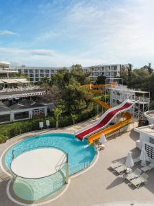 a swimming pool with a slide on a cruise ship at Kaya Side in Side