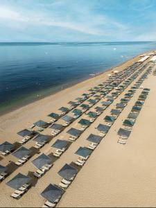 an aerial view of a beach with chairs and the water at Kaya Side in Side