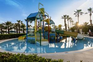 a water slide in a pool at a resort at Kaya Side in Side