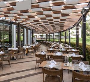 a restaurant with tables and chairs on a patio at Kaya Side in Side