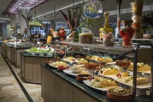 a buffet line with plates of food on display at Kaya Side in Side