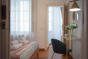 Posteľ alebo postele v izbe v ubytovaní Wine Apartments Florence Moscato