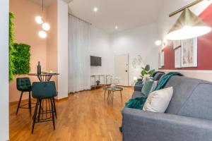 Televízia a/alebo spoločenská miestnosť v ubytovaní Wine Apartments Florence Moscato
