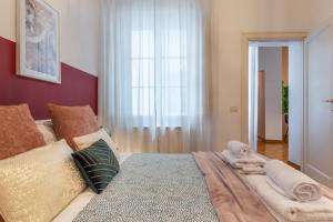 Posteľ alebo postele v izbe v ubytovaní Wine Apartments Florence Moscato