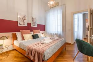 Posteľ alebo postele v izbe v ubytovaní Wine Apartments Florence Moscato