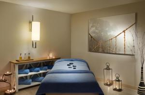 a bedroom with a bed and a bridge painting on the wall at Kaya Side in Side