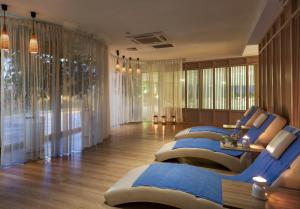 a room with a row of beds in it at Kaya Side in Side
