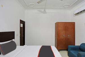 Postelja oz. postelje v sobi nastanitve Collection O Mayank Guest House Near ISKCON Temple Noida