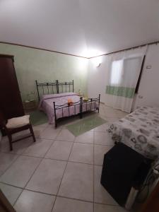 Postel nebo postele na pokoji v ubytování B&B Su Frascu Segau