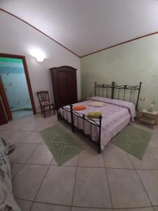 Postel nebo postele na pokoji v ubytování B&B Su Frascu Segau