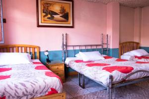 Postel nebo postele na pokoji v ubytování Hostal Carlos Luis