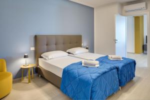 Ένα ή περισσότερα κρεβάτια σε δωμάτιο στο Oleandro Holiday Apartments +25 φωτογραφίες