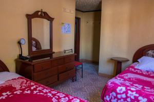 Postel nebo postele na pokoji v ubytování Hostal Carlos Luis