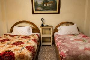 Postel nebo postele na pokoji v ubytování Hostal Carlos Luis