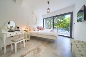 a bedroom with a bed and a desk and a mirror at Wellness villa Modruna in Grižane +133 photos