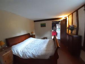 Postel nebo postele na pokoji v ubytování Les Hautes Charmante Ferme solognote