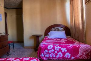 Postel nebo postele na pokoji v ubytování Hostal Carlos Luis