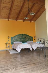 Postel nebo postele na pokoji v ubytování B&B La Tartaruga