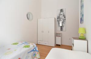 Łóżko lub łóżka w pokoju w obiekcie House Kacana 2163