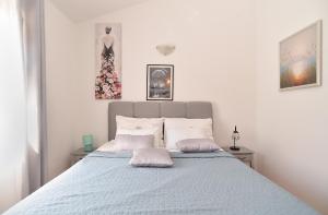 Łóżko lub łóżka w pokoju w obiekcie House Kacana 2163