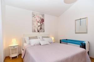 Łóżko lub łóżka w pokoju w obiekcie House Kacana 2163