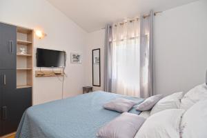Łóżko lub łóżka w pokoju w obiekcie House Kacana 2163