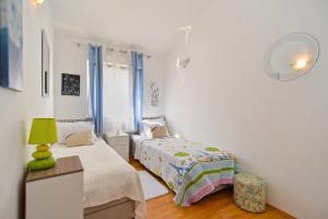 Łóżko lub łóżka w pokoju w obiekcie House Kacana 2163