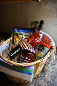 a basket filled with food and drinks on a counter at Crebilly Cottage - Rural Life doesn't get better in Ballymena