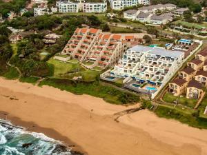 an aerial view of a resort on the beach at Skiathos at Beachfront Apartments in Shakas Rock in Ballito