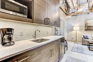 a kitchen with a sink and a microwave at Parker's Collection Unit 1 in Savannah
