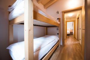A bed or beds in a room at Chalet Elena