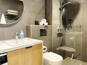 a bathroom with a shower and a toilet and a sink at Luxury Designer Suite in Tallinn