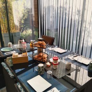 a table with a tray of pastries on it at Le Cosy Cabarieu in Saint-André-de-Cubzac