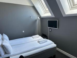 Postel nebo postele na pokoji v ubytování Unique Hotel Jungfrugatan