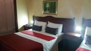 Postel nebo postele na pokoji v ubytování Hotel Chopin