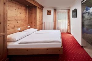 Voodi või voodid majutusasutuse Hotel Gasthof Siggen toas