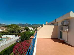 a balcony of a building with a view of a city at Bonito adosado en zona muy tranquila in Benicàssim