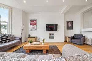 a living room with a couch and a coffee table at Luxury 2bed Apartment in Jesmond with Parking! in Jesmond