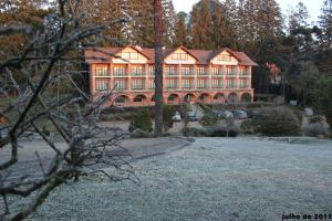 a large building with a yard in front of it at HOTEL CAMPO ALEGRE in Campo Alegre