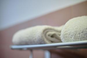 a close up of two towels on a shelf at Gess Hotel in Paramaribo