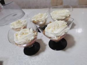 three bowls with ice cream in them on a table at Homestay JAISEL in Bishkek