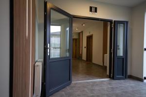 an open door to a hallway in a building at Apartamenty Lesko 23 in Lesko