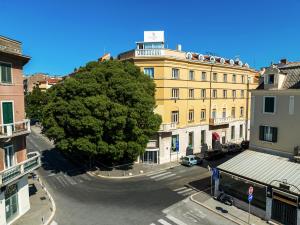 a large tree in the middle of a street at Hotel President Split in Split