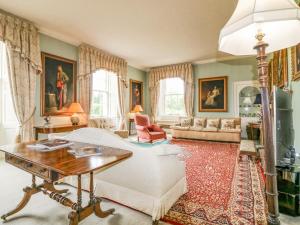 a living room with a couch and a table at Glamis House in Forfar